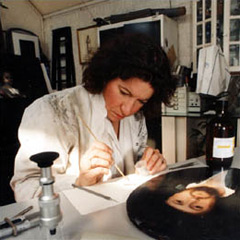 Valentine Walsh examining a painting